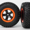 Traxxas Tire & wheel assy, glued (SCT black, orange beadlock wheels, SCT off-road racing tires, foam inserts) (2) (2WD front) – TRX5864